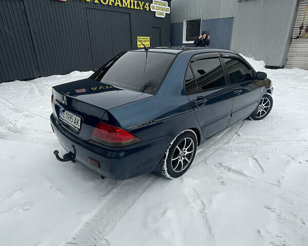 Синий Мицубиси Лансер, объемом двигателя 1.58 л и пробегом 319 тыс. км за 3700 $, фото 5 на Automoto.ua