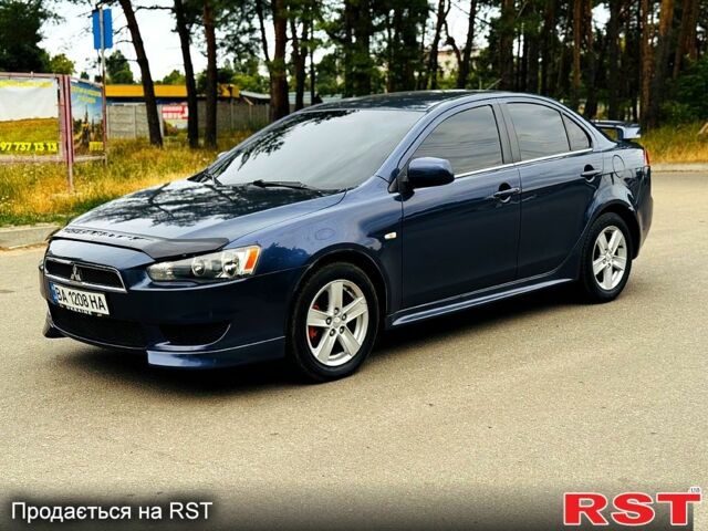 Синий Мицубиси Лансер, объемом двигателя 2 л и пробегом 170 тыс. км за 7500 $, фото 1 на Automoto.ua