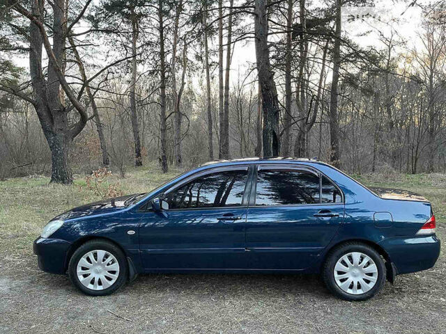 Синій Міцубісі Lancer, об'ємом двигуна 1.6 л та пробігом 176 тис. км за 6300 $, фото 7 на Automoto.ua