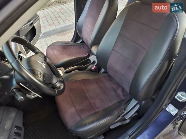 Синій Міцубісі Lancer, об'ємом двигуна 2 л та пробігом 234 тис. км за 6700 $, фото 14 на Automoto.ua
