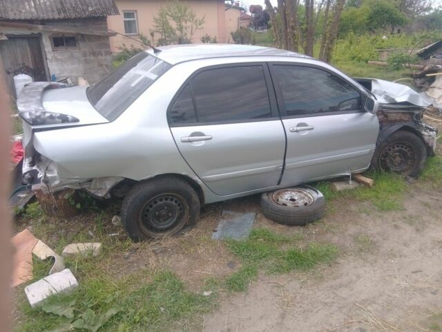Синій Міцубісі Lancer, об'ємом двигуна 1.6 л та пробігом 100 тис. км за 842 $, фото 7 на Automoto.ua