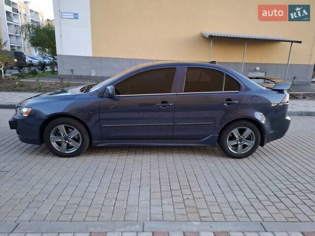 Синій Міцубісі Lancer, об'ємом двигуна 2 л та пробігом 234 тис. км за 6700 $, фото 8 на Automoto.ua