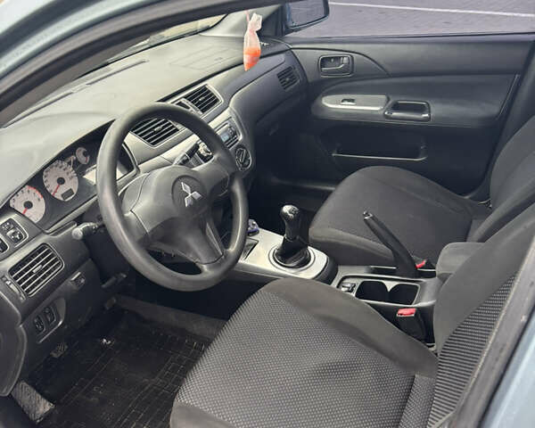 Синий Мицубиси Лансер, объемом двигателя 1.6 л и пробегом 238 тыс. км за 3500 $, фото 6 на Automoto.ua