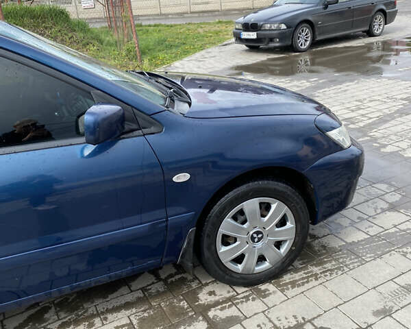 Синій Міцубісі Lancer, об'ємом двигуна 1.6 л та пробігом 245 тис. км за 3500 $, фото 6 на Automoto.ua