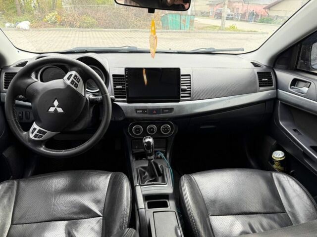 Синій Міцубісі Lancer, об'ємом двигуна 2 л та пробігом 324 тис. км за 5999 $, фото 11 на Automoto.ua