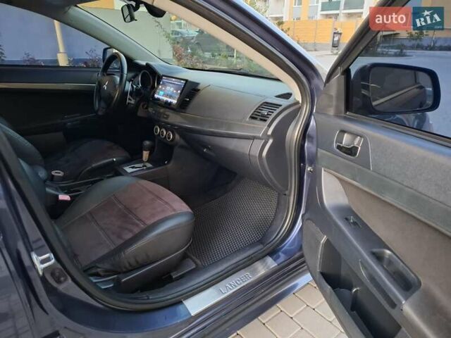 Синій Міцубісі Lancer, об'ємом двигуна 2 л та пробігом 234 тис. км за 6700 $, фото 11 на Automoto.ua