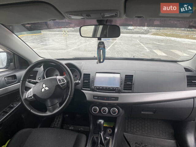 Синий Мицубиси Лансер, объемом двигателя 2 л и пробегом 193 тыс. км за 6800 $, фото 3 на Automoto.ua
