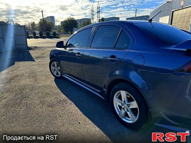 Синий Мицубиси Лансер, объемом двигателя 2 л и пробегом 250 тыс. км за 6500 $, фото 6 на Automoto.ua