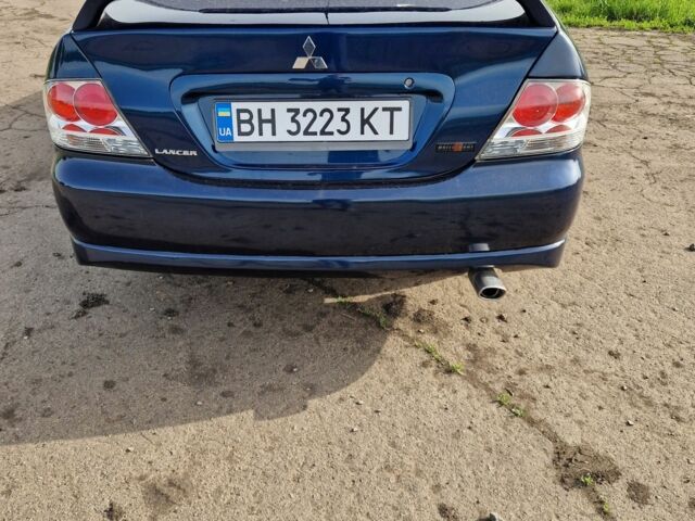 Синий Мицубиси Лансер, объемом двигателя 2 л и пробегом 260 тыс. км за 4200 $, фото 7 на Automoto.ua