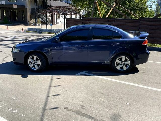 Синій Міцубісі Lancer, об'ємом двигуна 2 л та пробігом 300 тис. км за 5850 $, фото 3 на Automoto.ua