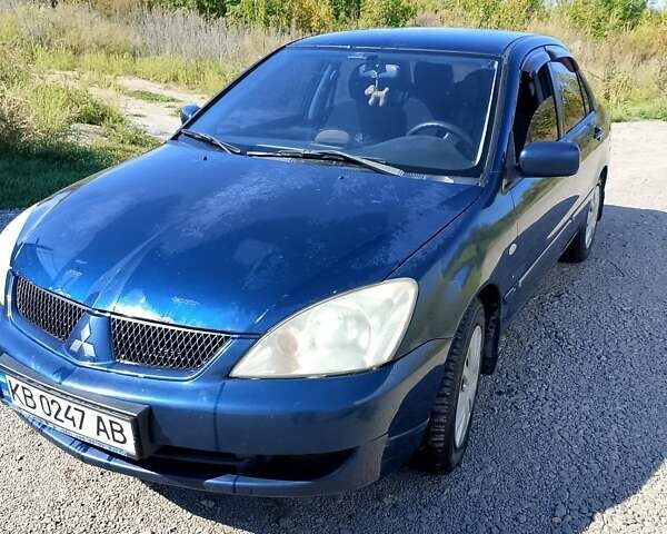 Синій Міцубісі Lancer, об'ємом двигуна 1.58 л та пробігом 317 тис. км за 3600 $, фото 8 на Automoto.ua