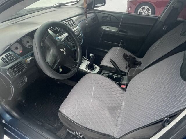 Синий Мицубиси Лансер, объемом двигателя 1.6 л и пробегом 319 тыс. км за 3700 $, фото 6 на Automoto.ua