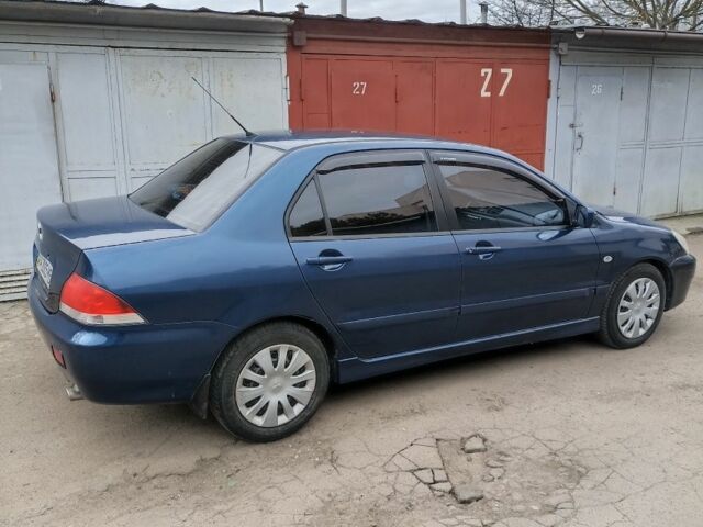 Синій Міцубісі Lancer, об'ємом двигуна 0.16 л та пробігом 294 тис. км за 4700 $, фото 6 на Automoto.ua