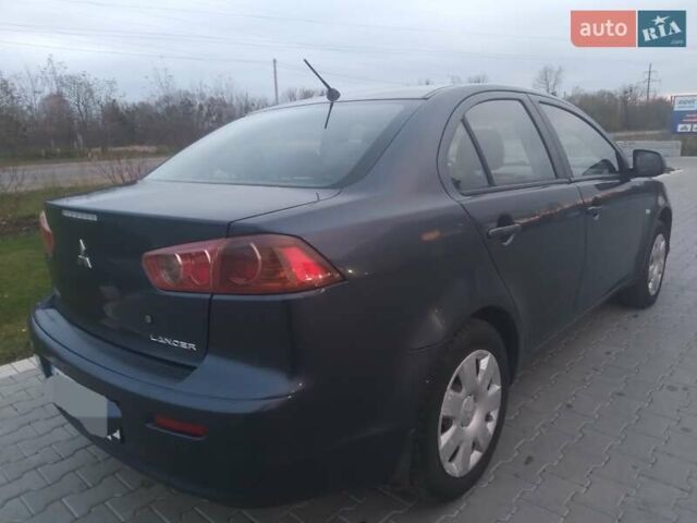 Синий Мицубиси Лансер, объемом двигателя 1.5 л и пробегом 260 тыс. км за 5000 $, фото 5 на Automoto.ua