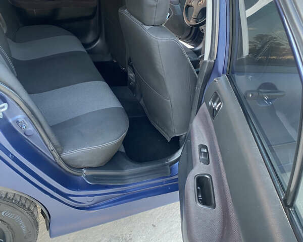 Синий Мицубиси Лансер, объемом двигателя 2 л и пробегом 100 тыс. км за 4999 $, фото 13 на Automoto.ua