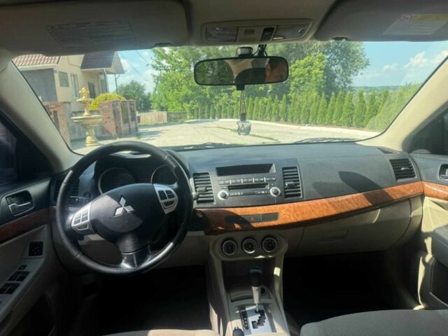 Синій Міцубісі Lancer, об'ємом двигуна 2 л та пробігом 180 тис. км за 3789 $, фото 5 на Automoto.ua