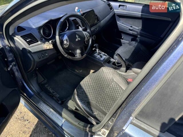Синій Міцубісі Lancer, об'ємом двигуна 2 л та пробігом 300 тис. км за 5800 $, фото 10 на Automoto.ua