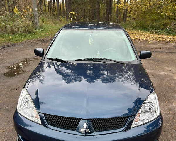 Синий Мицубиси Лансер, объемом двигателя 1.6 л и пробегом 150 тыс. км за 5700 $, фото 9 на Automoto.ua