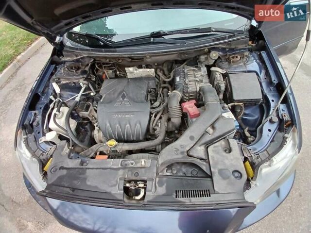 Синий Мицубиси Лансер, объемом двигателя 1.5 л и пробегом 220 тыс. км за 6999 $, фото 7 на Automoto.ua