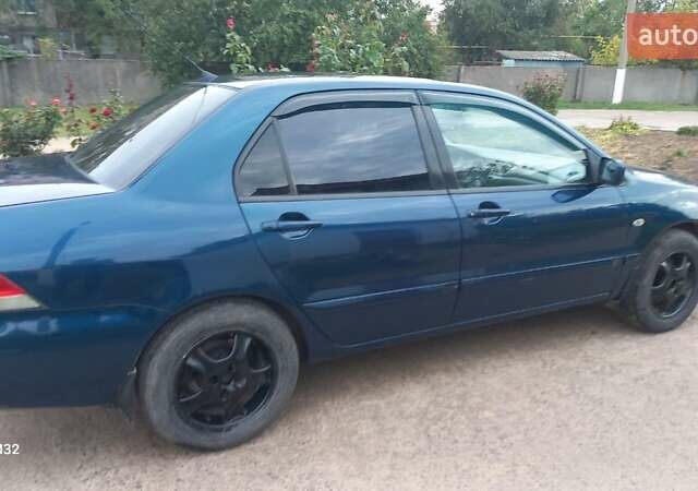 Синій Міцубісі Lancer, об'ємом двигуна 1.58 л та пробігом 220 тис. км за 4200 $, фото 2 на Automoto.ua