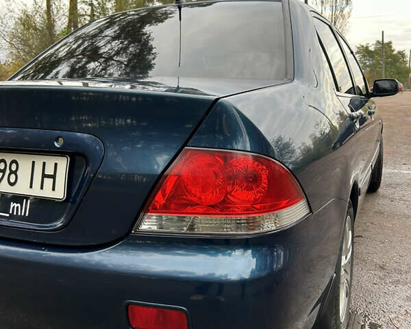 Синий Мицубиси Лансер, объемом двигателя 1.6 л и пробегом 150 тыс. км за 5700 $, фото 53 на Automoto.ua