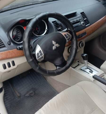 Синий Мицубиси Лансер, объемом двигателя 2 л и пробегом 300 тыс. км за 6900 $, фото 11 на Automoto.ua