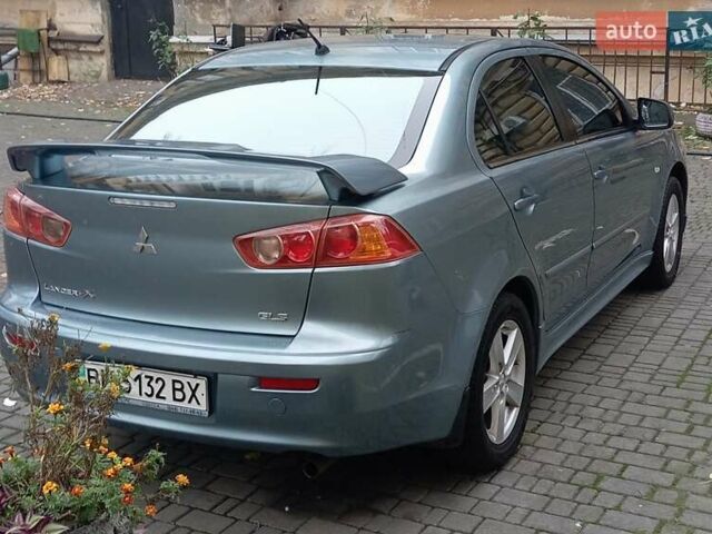 Синий Мицубиси Лансер, объемом двигателя 2 л и пробегом 300 тыс. км за 5600 $, фото 6 на Automoto.ua
