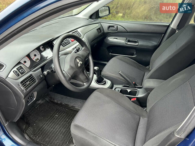 Синий Мицубиси Лансер, объемом двигателя 1.59 л и пробегом 126 тыс. км за 5950 $, фото 9 на Automoto.ua