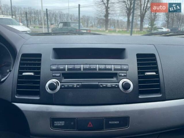 Синий Мицубиси Лансер, объемом двигателя 2 л и пробегом 142 тыс. км за 8000 $, фото 27 на Automoto.ua