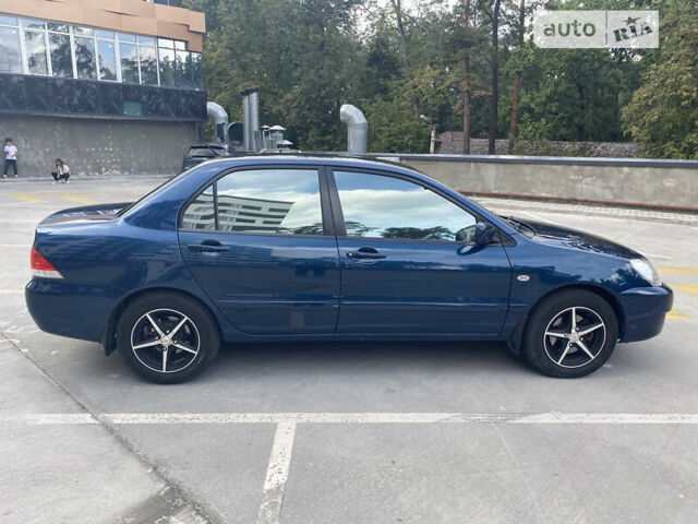Синій Міцубісі Lancer, об'ємом двигуна 1.6 л та пробігом 206 тис. км за 5500 $, фото 6 на Automoto.ua