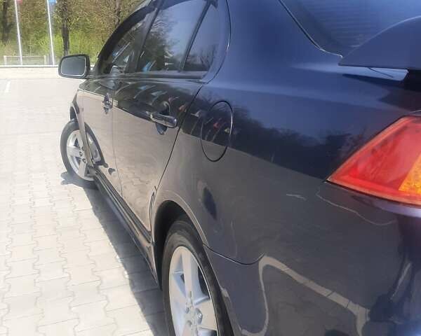 Синій Міцубісі Lancer, об'ємом двигуна 2 л та пробігом 142 тис. км за 8200 $, фото 5 на Automoto.ua