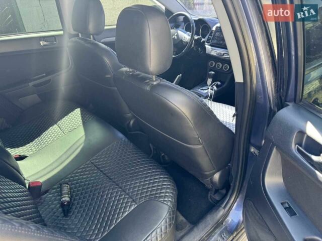 Синій Міцубісі Lancer, об'ємом двигуна 2 л та пробігом 300 тис. км за 5800 $, фото 11 на Automoto.ua