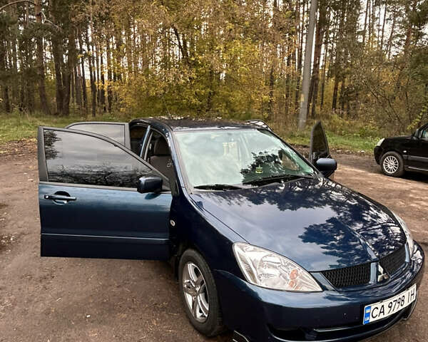 Синий Мицубиси Лансер, объемом двигателя 1.6 л и пробегом 150 тыс. км за 5700 $, фото 23 на Automoto.ua