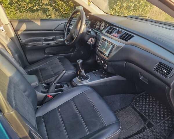 Синий Мицубиси Лансер, объемом двигателя 1.6 л и пробегом 197 тыс. км за 6500 $, фото 13 на Automoto.ua