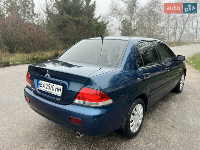 Синий Мицубиси Лансер, объемом двигателя 1.59 л и пробегом 126 тыс. км за 5950 $, фото 6 на Automoto.ua