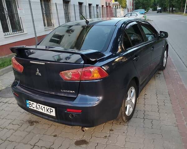 Синий Мицубиси Лансер, объемом двигателя 2 л и пробегом 290 тыс. км за 5000 $, фото 5 на Automoto.ua