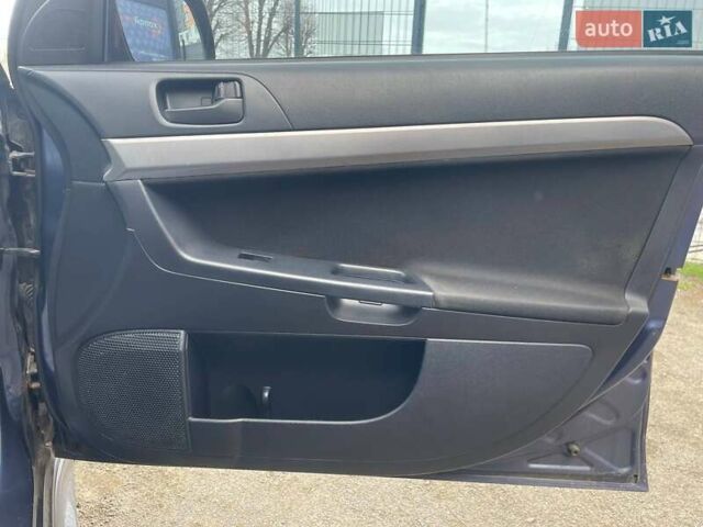 Синий Мицубиси Лансер, объемом двигателя 2 л и пробегом 142 тыс. км за 8000 $, фото 21 на Automoto.ua