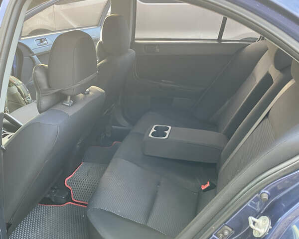 Синий Мицубиси Лансер, объемом двигателя 1.5 л и пробегом 247 тыс. км за 4500 $, фото 6 на Automoto.ua