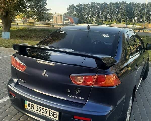 Синий Мицубиси Лансер, объемом двигателя 2 л и пробегом 142 тыс. км за 8000 $, фото 5 на Automoto.ua