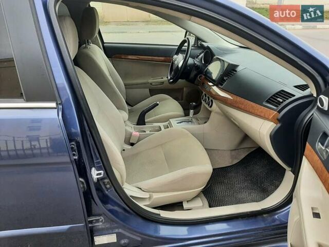 Синий Мицубиси Лансер, объемом двигателя 1.5 л и пробегом 220 тыс. км за 6999 $, фото 30 на Automoto.ua