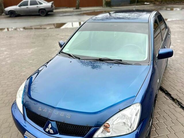 Синій Міцубісі Lancer, об'ємом двигуна 1.6 л та пробігом 153 тис. км за 5400 $, фото 8 на Automoto.ua