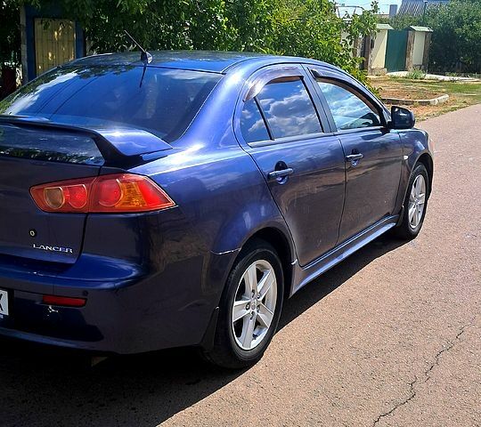 Синій Міцубісі Lancer, об'ємом двигуна 2 л та пробігом 242 тис. км за 5300 $, фото 5 на Automoto.ua