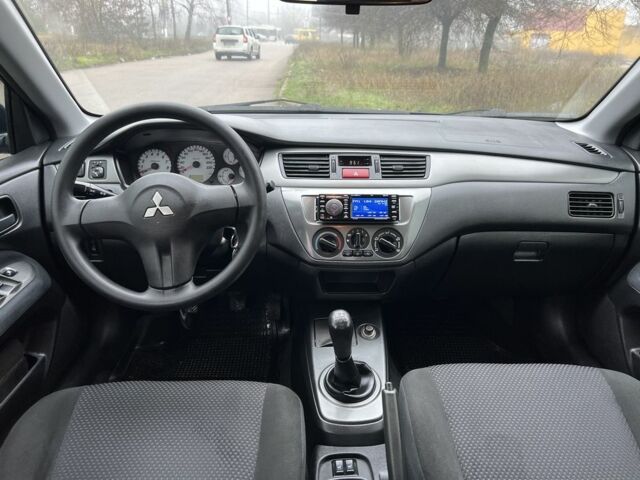 Синій Міцубісі Lancer, об'ємом двигуна 1.6 л та пробігом 126 тис. км за 5950 $, фото 10 на Automoto.ua