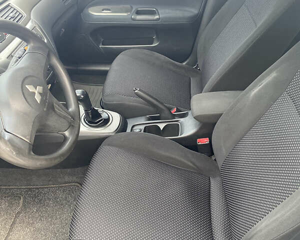 Синій Міцубісі Lancer, об'ємом двигуна 1.6 л та пробігом 206 тис. км за 5500 $, фото 11 на Automoto.ua