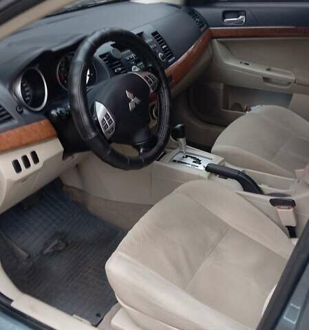 Синий Мицубиси Лансер, объемом двигателя 2 л и пробегом 300 тыс. км за 6900 $, фото 10 на Automoto.ua