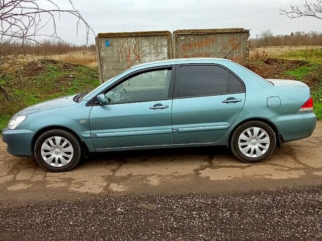 Синій Міцубісі Lancer, об'ємом двигуна 1.6 л та пробігом 167 тис. км за 4700 $, фото 2 на Automoto.ua
