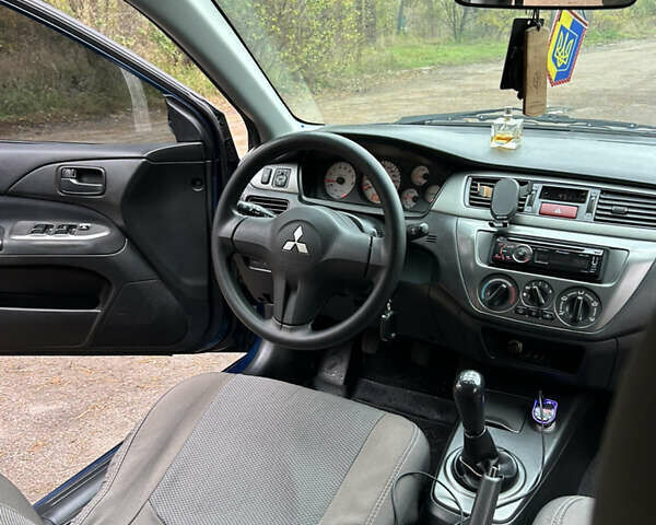 Синий Мицубиси Лансер, объемом двигателя 1.6 л и пробегом 150 тыс. км за 5700 $, фото 41 на Automoto.ua