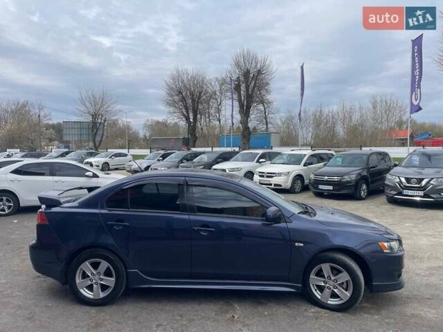 Синий Мицубиси Лансер, объемом двигателя 2 л и пробегом 142 тыс. км за 8000 $, фото 3 на Automoto.ua