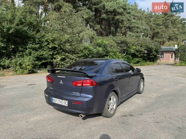 Синій Міцубісі Lancer, об'ємом двигуна 2 л та пробігом 300 тис. км за 5800 $, фото 6 на Automoto.ua