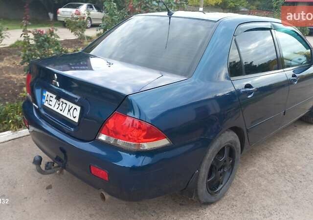 Синій Міцубісі Lancer, об'ємом двигуна 1.58 л та пробігом 220 тис. км за 4200 $, фото 5 на Automoto.ua